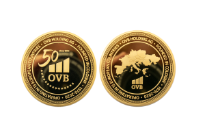 Custom Anniversary Coins made from Gold. 50 Years Anniversary.OVB Holding Coins