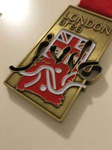Rectangular medal embossed in bronze antique with soft enamel details