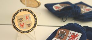 Ceremony coins made from bronze_plated in 24K Gold_sandblasted background_hard enamel details