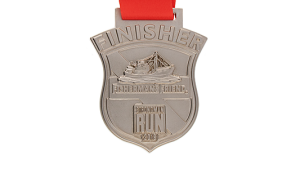 Custom-minted coin in irregular shape as Sproting event Finisher medal with ribbon.