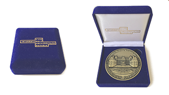 Custom embossed college coins_custom-minted 3D coins in the blue velvet box