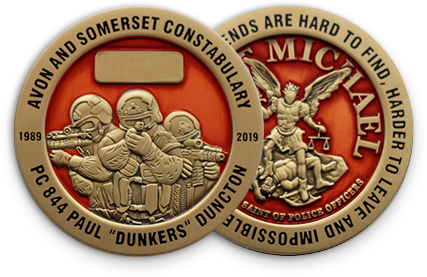 Fully customized challenge coins minted in bronze antique with red enamel